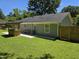 Spacious backyard with well-manicured lawn and wooden pergola at 1016 Buckhorn Rd, Garner, NC 27529