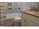Stylish bathroom with granite counters, tiled shower and floors at 1016 Buckhorn Rd, Garner, NC 27529