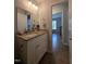 Bathroom with granite countertop vanity, mirror, and stylish lighting at 1016 Buckhorn Rd, Garner, NC 27529