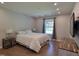 Bright bedroom with a large window, hardwood floors, and ample closet space at 1016 Buckhorn Rd, Garner, NC 27529