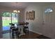 This dining area has modern decor with a wooden table set and a sliding door leading to the backyard at 1016 Buckhorn Rd, Garner, NC 27529