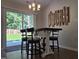An inviting dining space features a wooden dining table set and a sliding glass door to the patio at 1016 Buckhorn Rd, Garner, NC 27529