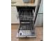 Stainless steel dishwasher with an open door and pull-out racks for easy loading at 1016 Buckhorn Rd, Garner, NC 27529