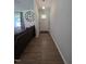 Entryway with wood floors, a front door with sidelights, and a decorative clock at 1016 Buckhorn Rd, Garner, NC 27529