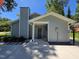 Side exterior view of the home featuring a fenced backyard, outdoor bench, and walkway at 1016 Buckhorn Rd, Garner, NC 27529