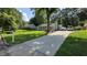 Inviting front exterior featuring a long driveway and cozy well-landscaped front yard at 1016 Buckhorn Rd, Garner, NC 27529
