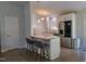 Updated kitchen featuring an island with barstool seating, stainless steel appliances, and white cabinetry at 1016 Buckhorn Rd, Garner, NC 27529