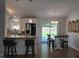 Bright, open kitchen with a breakfast bar, stainless steel appliances, and a view to the backyard at 1016 Buckhorn Rd, Garner, NC 27529