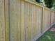 Backyard wooden fence with posts and horizontal rails creates privacy and security at 1016 Buckhorn Rd, Garner, NC 27529