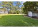Large backyard with lush green grass and mature trees at 1031 Old Us 421, Lillington, NC 27546