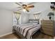 Bedroom features a wooden dresser, wood-look floors, and natural light at 1031 Old Us 421, Lillington, NC 27546