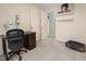 Bedroom with neutral walls, an open door, and a desk at 109 Crane Meadow Pl, Chapel Hill, NC 27514