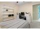 This bedroom has a workspace with white shelving, drawers, and a comfortable office chair at 109 Crane Meadow Pl, Chapel Hill, NC 27514