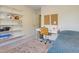 Bedroom study area with a white desk, cork board, white shelves, and natural lighting at 109 Crane Meadow Pl, Chapel Hill, NC 27514
