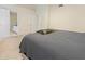 Cozy bedroom showcasing neutral tones and a view to dual entryways to adjacent rooms at 109 Crane Meadow Pl, Chapel Hill, NC 27514