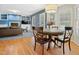 Charming dining room features a round table and views of the fireplace and living space at 109 Crane Meadow Pl, Chapel Hill, NC 27514