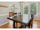 Cozy dining room featuring hardwood floors, wainscotting, and lots of natural light at 109 Crane Meadow Pl, Chapel Hill, NC 27514