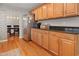 Functional kitchen area with stainless steel refrigerator and ample cabinetry for storage at 109 Crane Meadow Pl, Chapel Hill, NC 27514