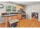Stylish kitchen boasts granite countertops, stainless steel appliances, and hardwood floors at 109 Crane Meadow Pl, Chapel Hill, NC 27514
