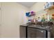 This laundry room has large, modern washer and dryer units and storage at 109 Crane Meadow Pl, Chapel Hill, NC 27514