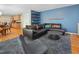 Open-concept living room with hardwood floors, modern decor, and seamless flow to the kitchen at 109 Crane Meadow Pl, Chapel Hill, NC 27514