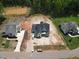 Aerial view of new home in development showing landscaping and proximity to green space at 1112 Delilia Ln, Wake Forest, NC 27587