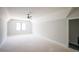 Spacious bedroom featuring a ceiling fan and ample natural light from a large window at 1112 Delilia Ln, Wake Forest, NC 27587