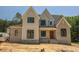 Beautiful two-story home featuring stone accents and a modern farmhouse design at 1112 Delilia Ln, Wake Forest, NC 27587