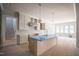 Spacious kitchen featuring a large island, modern pendant lighting, and plenty of natural light at 1112 Delilia Ln, Wake Forest, NC 27587