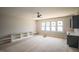 Bright living room featuring built-in shelves and cabinets with a window providing natural light at 1112 Delilia Ln, Wake Forest, NC 27587