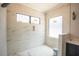 Contemporary walk-in shower with white marble tile and sleek fixtures at 1112 Delilia Ln, Wake Forest, NC 27587