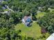 Lush, treed lot from above, the surrounding neighborhood and nearby parking lot at 118 N 7Th St, Smithfield, NC 27577