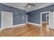 This bedroom boasts hardwood floors, a ceiling fan, and two doors, and is freshly painted at 118 N 7Th St, Smithfield, NC 27577