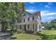 Charming two-story home with a large front porch and well-maintained landscaping at 118 N 7Th St, Smithfield, NC 27577