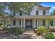 Charming home featuring a classic front porch with elegant columns and a welcoming entrance at 118 N 7Th St, Smithfield, NC 27577
