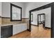 Classic kitchen layout with white cabinets, stainless steel dishwasher, and tiled backsplash for a clean design at 118 N 7Th St, Smithfield, NC 27577