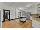 Large kitchen features an island with seating, stainless steel appliances, and access to other areas of the home at 118 N 7Th St, Smithfield, NC 27577