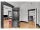 View of a living room with hardwood floors and detailed trim through an open doorway at 118 N 7Th St, Smithfield, NC 27577