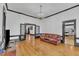 Comfortable living room with hardwood floors, chandelier, and open access to other rooms at 118 N 7Th St, Smithfield, NC 27577