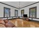 Bright, airy living room with hardwood floors and many windows for natural light at 118 N 7Th St, Smithfield, NC 27577