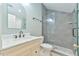 Modern bathroom with a gray-tiled walk-in shower, marble vanity, and sleek fixtures at 119 Jones Creek Place Pl # 119, Chapel Hill, NC 27516