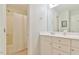 Well-lit bathroom showcasing a double vanity with sleek fixtures and a shower with a curtain at 119 Jones Creek Place Pl # 119, Chapel Hill, NC 27516
