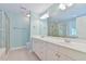 Bright bathroom with double vanity, white cabinets, and a glass-enclosed shower at 119 Jones Creek Place Pl # 119, Chapel Hill, NC 27516