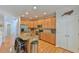 Kitchen boasting granite counters, stainless appliances, breakfast bar, and hardwood floors at 119 Jones Creek Place Pl # 119, Chapel Hill, NC 27516