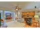 Open-concept living space with hardwood floors, a ceiling fan, and natural light at 119 Jones Creek Place Pl # 119, Chapel Hill, NC 27516