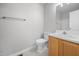 Well-lit bathroom featuring a toilet, vanity, and a large mirror, providing functionality at 119 Percheron Dr, Zebulon, NC 27597