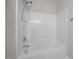A clean, all-white tub and shower combination creating a refreshing bathing space at 119 Percheron Dr, Zebulon, NC 27597