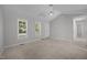 Bright primary bedroom with neutral carpet, and dual windows at 119 Percheron Dr, Zebulon, NC 27597