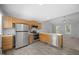 This kitchen features stainless steel appliances, wood cabinets and hard surface countertops at 119 Percheron Dr, Zebulon, NC 27597