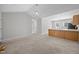 Bright and airy living area boasts neutral walls and carpet and flows into other living spaces at 119 Percheron Dr, Zebulon, NC 27597